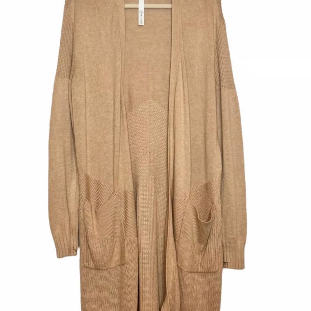 A camel colored lulu lemon cardigan. Cozy but still light it perfect for fall!